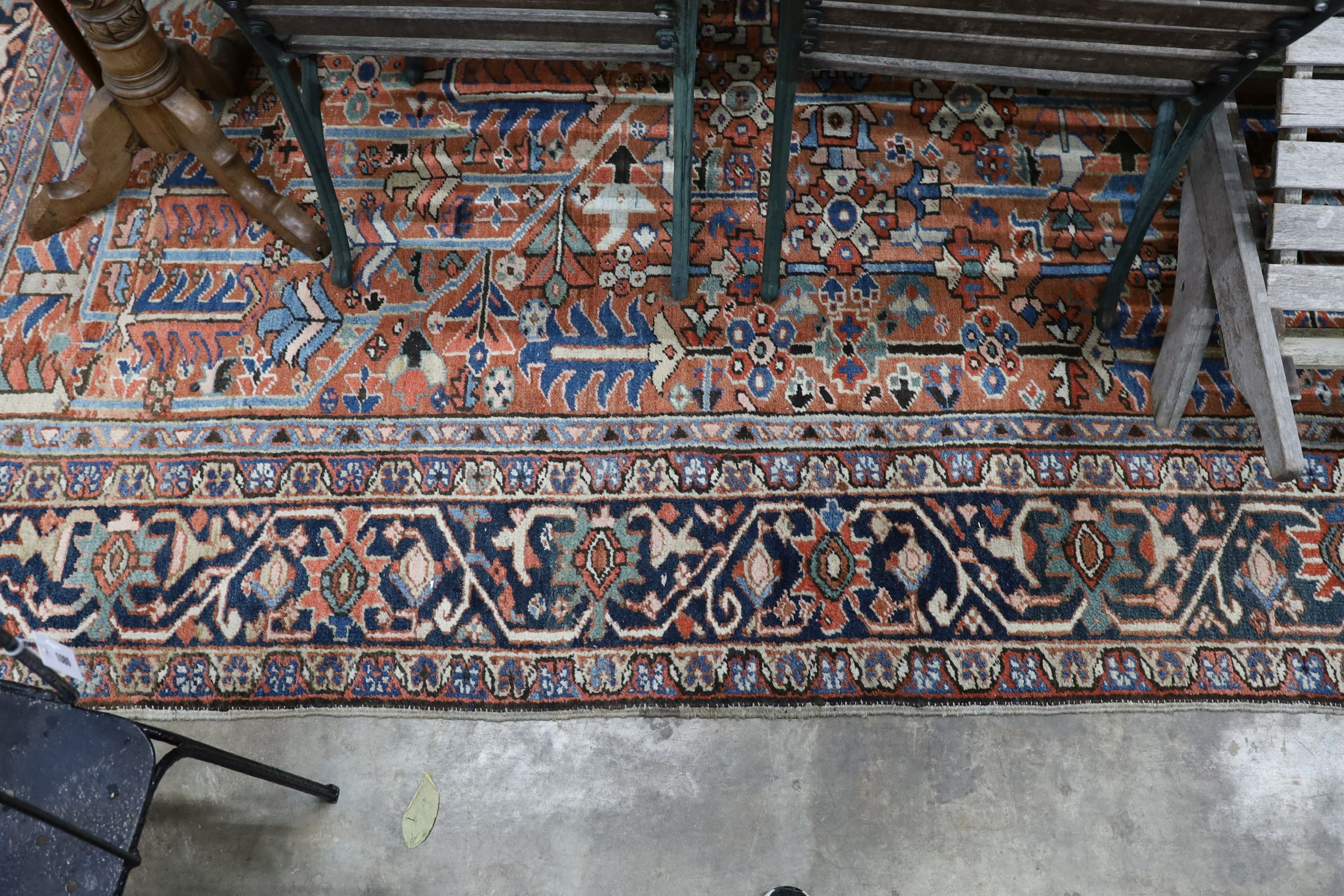 A Caucasian red ground carpet, 390 x 285cm